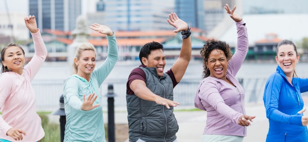 Exercise group having fun together outdoors