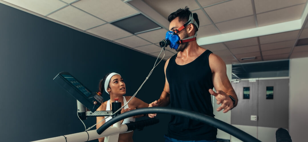 man with exercise mask on treadmill